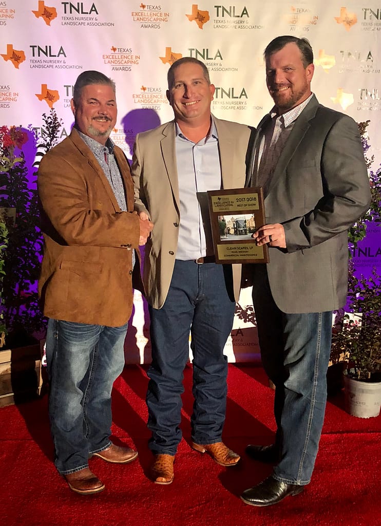 Pictured from Left to Right- Brett Nichols, Richie Bartek, Matt Stults accepting an award for Texas Excellence in Landscaping