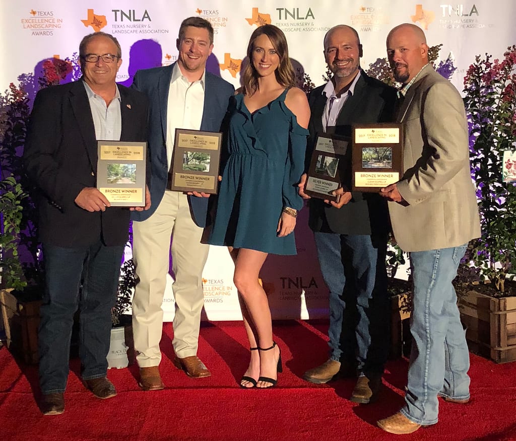 Pictured Left to Right: Ivan Giraldo, Alex Lee, Kaleigh Meighen, Jorge Espinosa, Greg Fox accepting an award for Texas Excellence in Landscaping