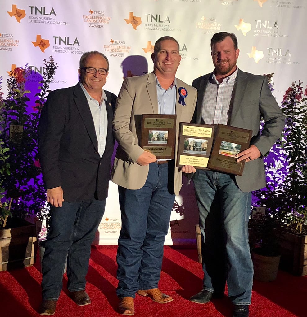 Pictured Left to Right: Ivan Giraldo, Richie Bartek, Matt Stults accepting an award for Texas Excellence in Landscaping